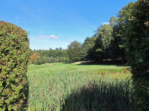 An attractive pond crosses the 2nd fairway