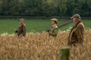Female keeper out in field