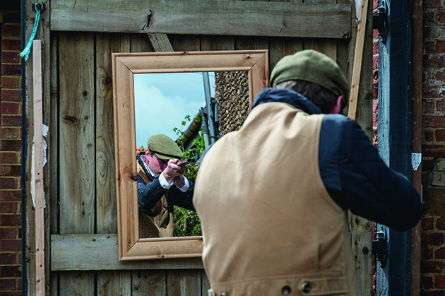 Mounting the gun while looking into the mirror