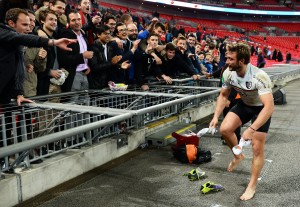 Sock it too me: Maxime Medard of Toulouse hands kit to the crowd after win