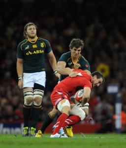 Vice-like grip: Etzebeth puts pressure on Warburton