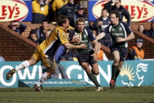 Support system: Bishop runs with the ball, can you recognise the England coach next to him?!