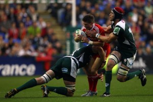 Dynamic duo: Casey (tackling O'Gara) and Kennedy formed a successful partnership