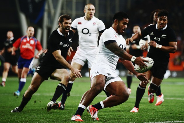 Scuttling off the wing: Manu Tuilagi had mixed fortunes playing at 14 for England