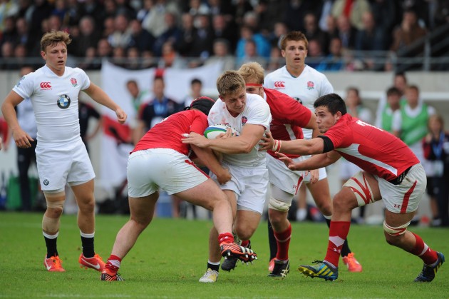 Fresh faces: Sam Hill carries while Henry Slade watches on in their England Under 20 days