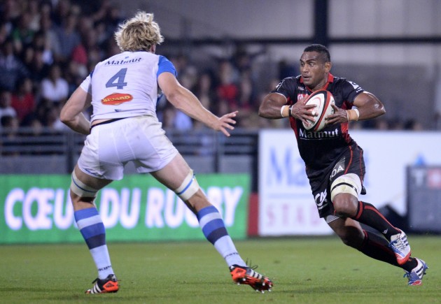 Breaking free: Lyon's Waisele Sukanaveita runs against Castres