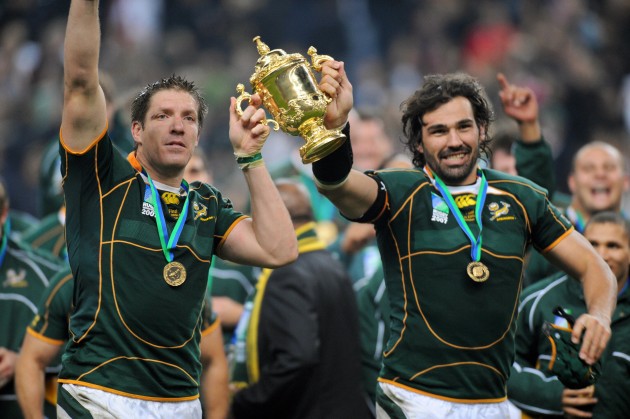 Towers of power - Bakkies Botha and Victor Matfield holding the William Webb Ellis cup