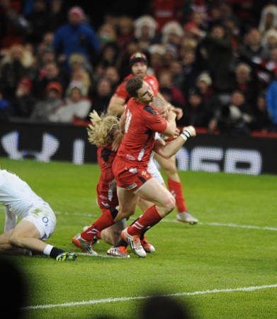 Heading for the floor: George North on his way to the turf during the second half. Photo: Huw Evans Agency