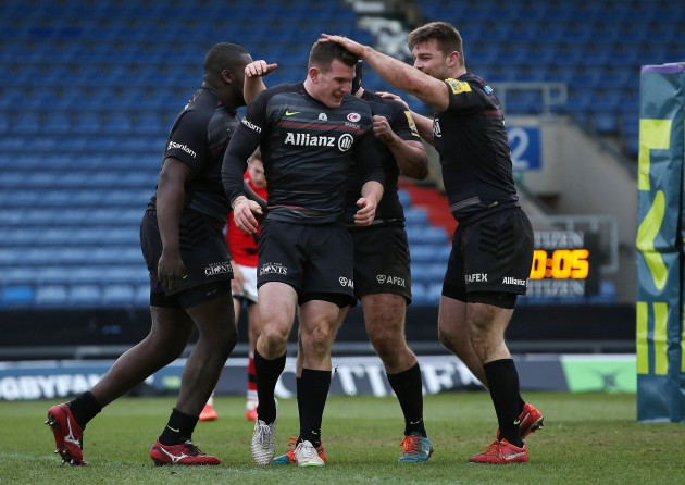 Hero or villain? Ben Spencer is congratulated by his Saracens team-mates. Photo Action Images