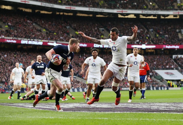 Long arms of the Lawes: England's lock bears down on Scotland fly-half Finn Russell