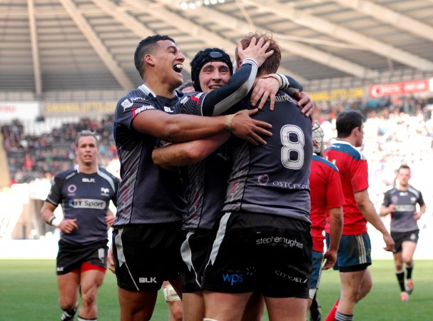 All smiles: The Ospreys celebrate the try scored by No 8 Dan Baker on their way to a win over Munster. (Photo: Inpho)