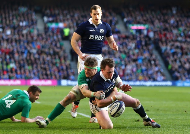 Champion tackle: Jamie Heaslip stops Stuart Hogg from scoring. (Photo: Inpho)