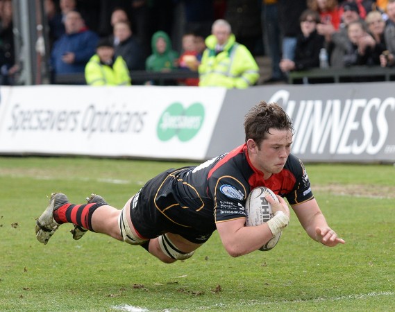 At the double: James Benjamin scores the second of his two tries for the Dragons. (Photo: Inpho)