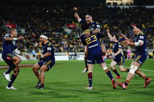 Magic moment: The Highlanders celebrate at the final whistle of the Super 15 decider