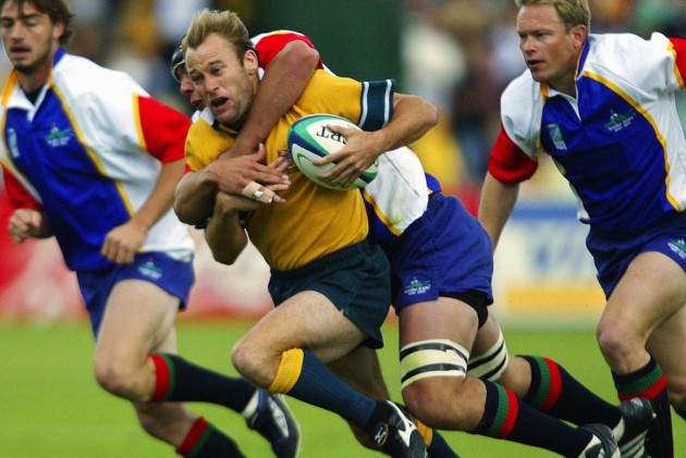 Australian captain Chris Whitaker is tackled in the 2003 World Cup