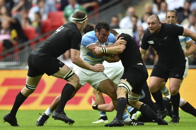 Slogging away: Agustin Creevy carries into the heart of the All Blacks