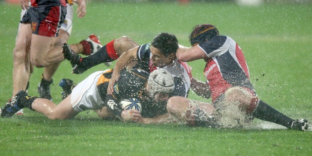 Slip n slide: Glen Gregory helps make a tackle for the Makos