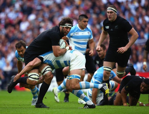 Carry hard: Sam Whitlock runs into Argentina