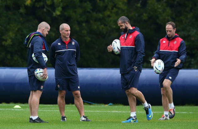 Fcing a tough time: The England coaching staff at training
