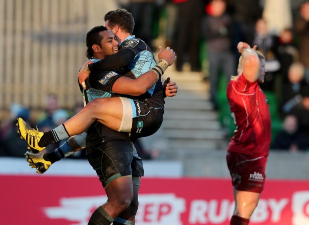 Hug for a hat-trick: Taqele Naiyaravoro celebrates with Grayson Hart. (Photo: Inpho)
