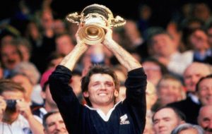 David Kirk holds aloft the Webb Ellis Cup