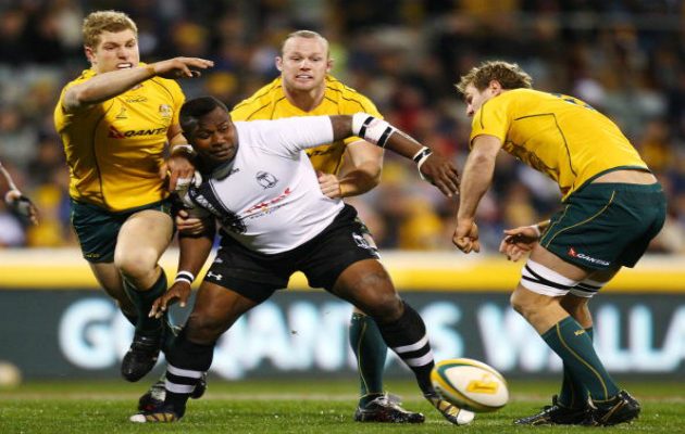 Rupeni Caucaunibuca fends off the Aussies