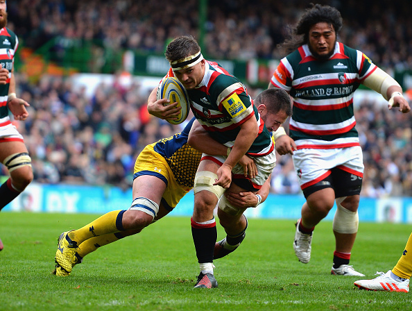 Tiger tackled: Will Evans is caught during an Aviva Premiership match.