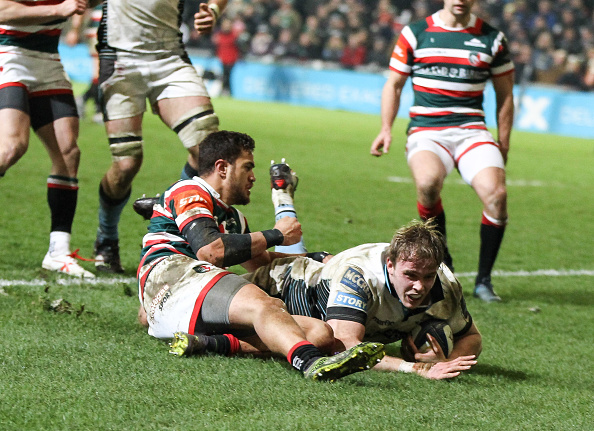 Captain's contribution: Jonny Gray scores one of Glasgow's six tries at Welford Road.