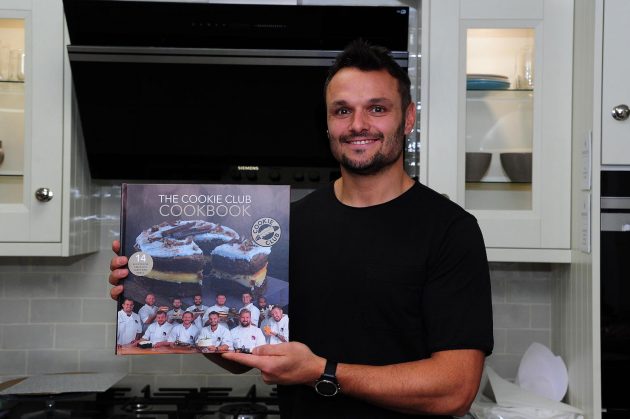 Phill Dollman with his cookbook