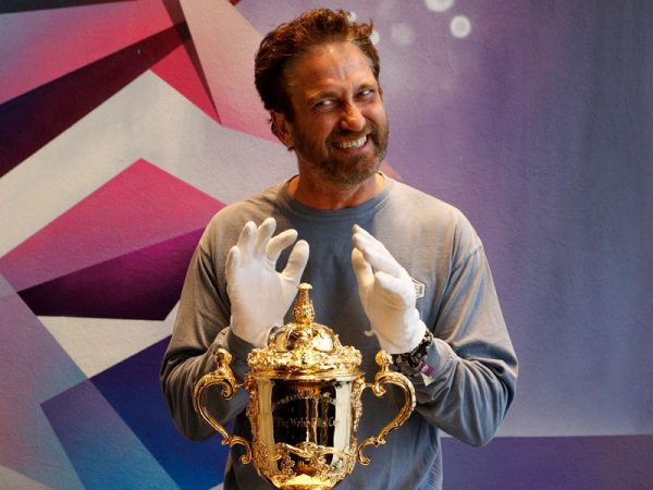 Gerard Butler Gets To Grips With Rugby World Cup Trophy