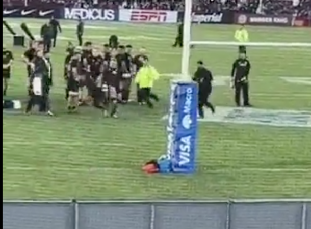 Sam Cane kicks pitch invader