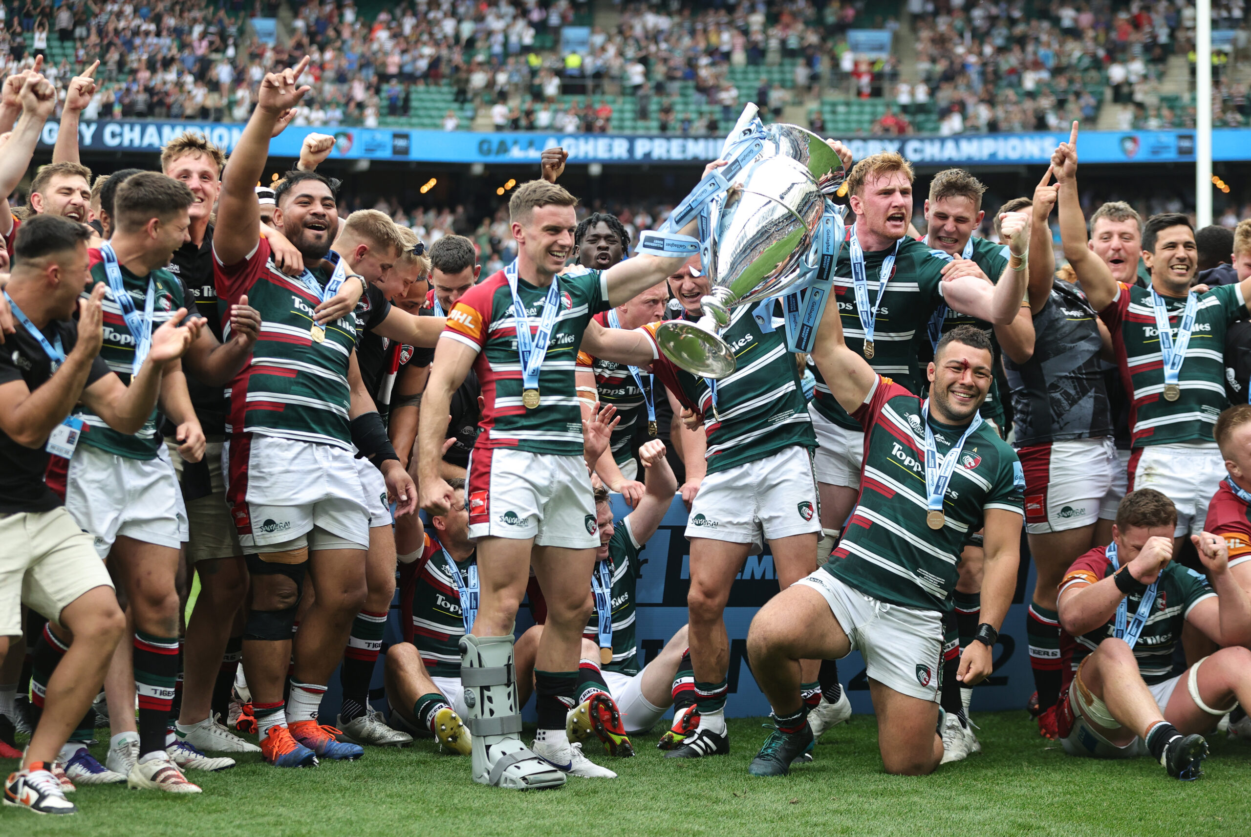 George Ford and Ellis Genge of Leicester Tigers lift the Gallagher Premiership trophy with their teammates, following their victory in the 2022 final