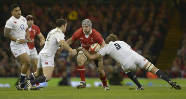 Wales's Jonethan Davies gets tackled during the Six Nations 2013 match against England.