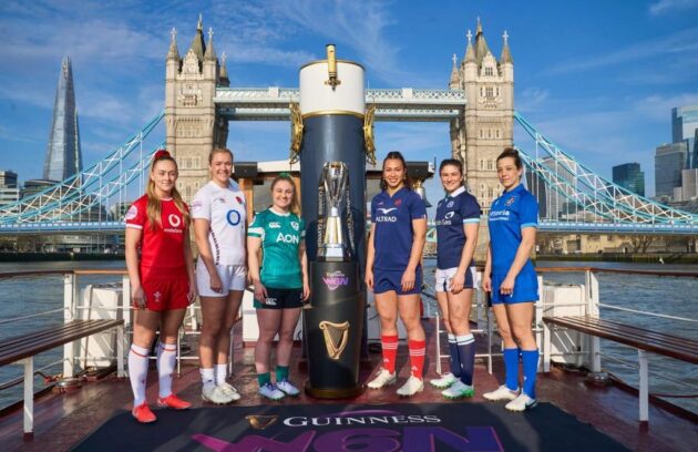 Players from each of the participating countries pose with the Women's Six Nations trophy in front of Tower Bridge in London