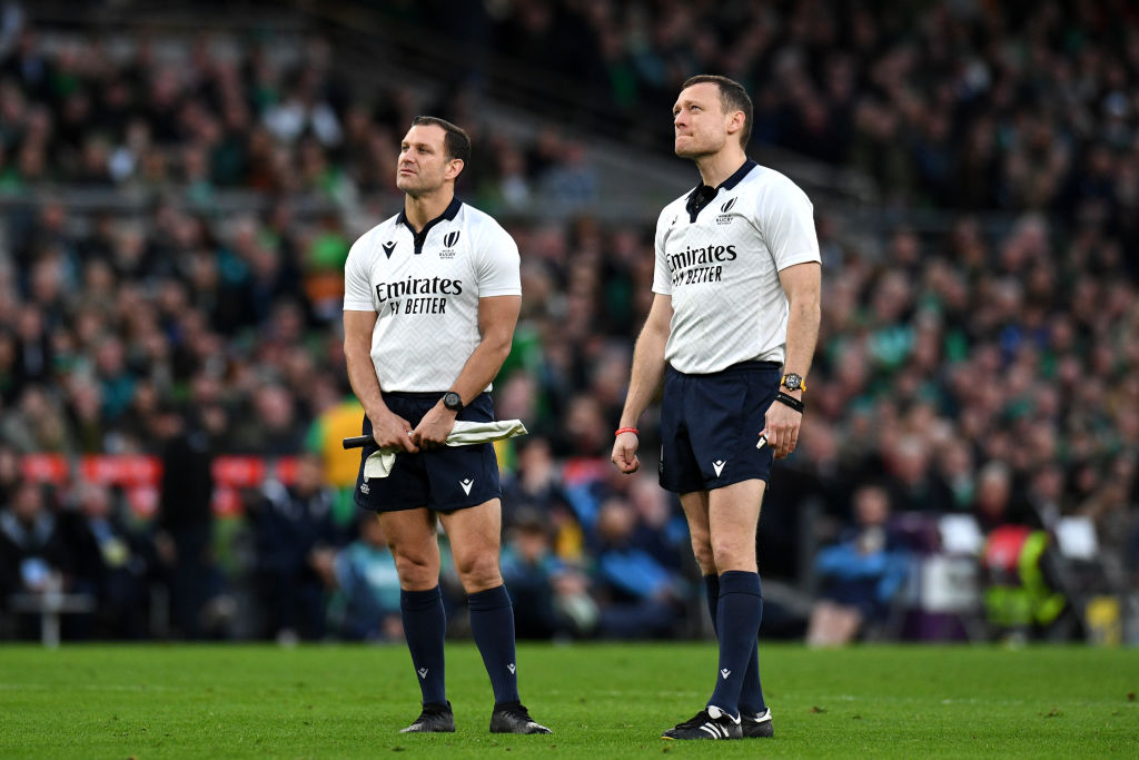 English officials Karl Dickson and Matthew Carley look at the big screen during the Ireland v Scotland Six Nations match in 2024.