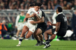 England's Marcus Smith is tackled during the second test match of his team's 2024 summer tour to New Zealand.