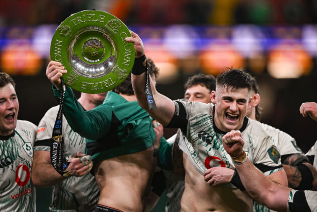 Ireland captains Dan Sheehan and Caelan Doris lift the Triple Crown trophy after beating Wales in the 2025 Six Nations