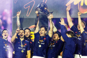 France's Damian Penaud lifts the Six Nations trophy in 2025 after the final championship match against Scotland
