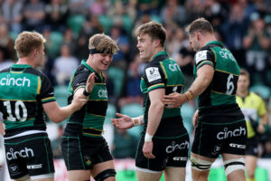 Northampton Saints’ Tommy Freeman celebrates scoring the first try of his team’s European Champions Cup win over Castres with Fin Smith, Henry Pollock and Josh Kemeny