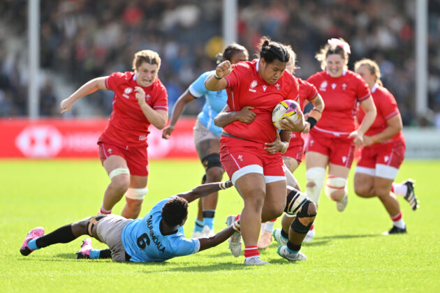 Wales' Sisilia Tuipulotu is tackled by Fiji's Nunia Daunimoala and Alfreda Fisher during the 2025 Women’s Rugby World Cup pool match