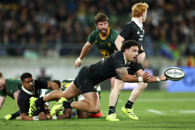 New Zealand’s Billy Proctor passes the ball during a 2025 Rugby Championship match against South Africa.