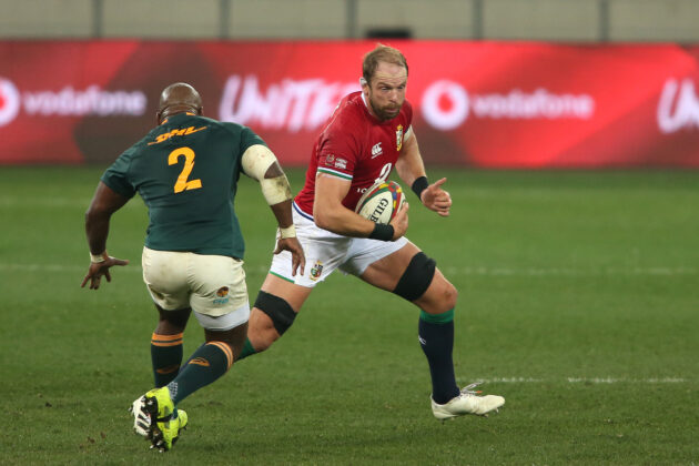 British & Irish Lions captain Alun Wyn Jones runs with the ball as South Africa's Bongi Mbonambi looks on.