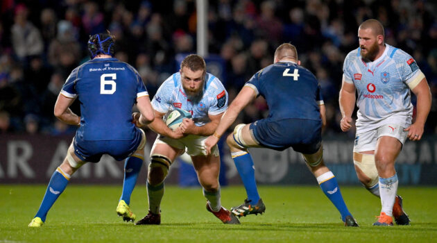 Gerhard Steenekamp of the Bulls carries the ball into contact with Leinster's Ryan Baird and Ross Molony.