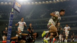 Bordeaux-Begles' French centre Nicolas Depoortere (R) runs for a try during the French Top14 rugby union match between Union Bordeaux-Begles (UBB) and Stade Toulousain at the Bordeaux Atlantique stadium in Bordeaux on March 23, 2025.