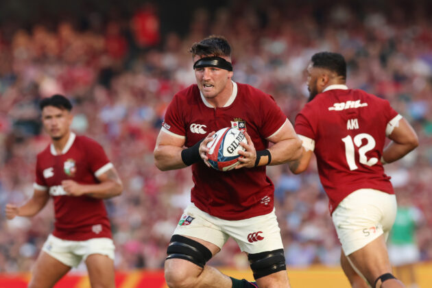 The British & Irish Lions' Tom Curry runs with the ball during the June 2025 match against Argentina.