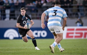 England's George Ford runs with the ball during the 5 July Test match against Argentina.