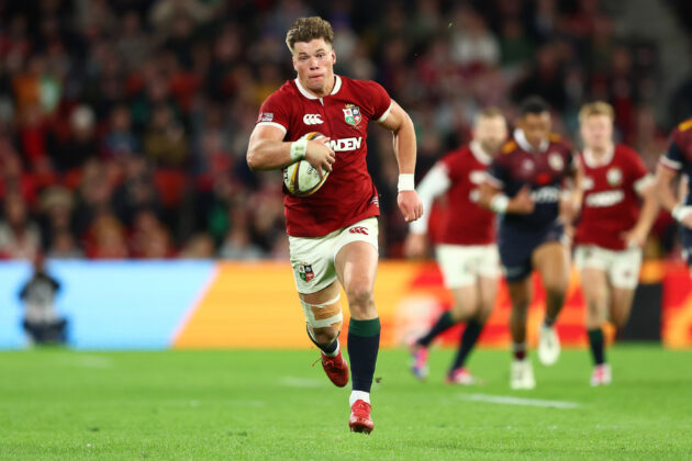 The British & Irish Lions’ Huw Jones runs with the ball during the 2025 match against Queensland Reds.