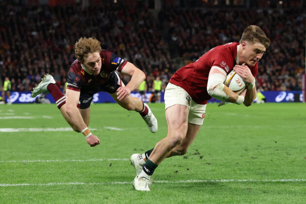The British & Irish Lions' Tommy Freeman in the process of scoring a try against the Queensland Reds.