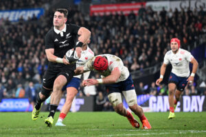 Will Jordan of New Zealand makes a pass as a France player attempts a tackle during the first July 2025 Test