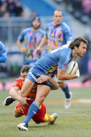 Paris' Juan Martin Hernandez (R) is tackled by Perpignan's centre Maxime Mermoz during the Top 14 (LIONEL BONAVENTURE/AFP via Getty Images)